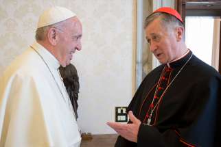 Pope Francis greets Cardinal Blase J. Cupich of Chicago during a meeting in the Apostolic Palace at the Vatican May 17. 