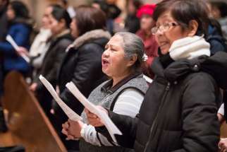 Filipinos worship at Holy Rosary Cathedral in Vancouver Dec. 15, 2016. According to a recent Angus Reid Survey, religion is still a strong force in Canada.