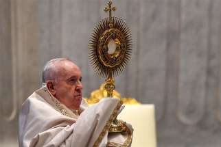 Pope Francis leads Benediction at the conclusion of the Mass marking the feast of Corpus Christi in St. Peter&#039;s Basilica at the Vatican June 14, 2020. The Mass was celebrated with a small congregation of some 50 people as part of efforts to contain spread of the coronavirus.