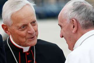  Cardinal Donald W. Wuerl of Washington talks with Pope Francis at Andrews Air Force Base in Maryland near Washington Sept. 22, 2015. Cardinal Wuerl announced Sept. 11 that he will meet soon with the pope to discuss the resignation he submitted three years ago when he turned 75.