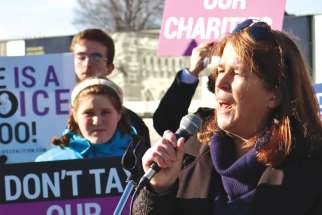 Carol Butler addresses a Parliament Hill crowd fighting to maintain charitable status for pregnancy centres.