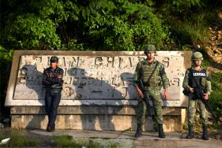 Members of the National Guard keep watch at a checkpoint in Mexico&#039;s Chiapas state June 16, 2019. A catechist instructor was shot dead June 15 at Immaculate Conception chapel in Acacoyagua, about 75 miles from the border with Guatemala.