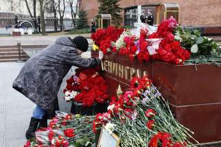 A Russian woman weeps as she lays flowers at a memorial April 4 in Moscow in memory of victims of a bomb blast the previous day in St. Petersburg. The metro attack, which killed at least 11 people and wounded dozens more, was carried out by a suicide bomber, said Russian officials.