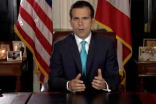 Puerto Rican Gov. Ricardo Rossello announces his resignation in San Juan late July 24, 2019. Rossello resigned amid a torrent of protests over vulgar, mean-spirited texting conversations recently made public across the island.