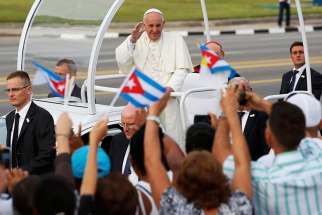Pope Francis waves to the crowd as he arrives to celebrate Mass in Revolution Square in Havana Sept. 20.