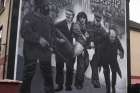 Irish Bishop Edward Daly, depicted on the far right of a mural commemorating the events of Bloody Sunday, became prominent in a photograph of him holding out a bloody handkerchief when British soldiers opened fired on a civilian protest march in Derry, Northern Ireland, January 30, 1972.