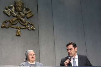 Alessandro Gisotti, interim director of the Vatican press office, introduces Consolata Sister Eugenia Bonetti at a Vatican news conference April 17, 2019. Sister Bonetti has led a major international effort by religious orders to fight human trafficking and help women and girls rebuild their lives after they were tricked by traffickers into prostitution. She was asked to write the meditations for this year&#039;s Way of the Cross at Rome&#039;s Colosseum. 