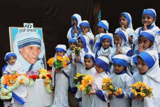 Girls dressed up as Blessed Mother Teresa during an Aug. 26 event to commemorate her 104th birth anniversary in a school in Bhopal, India. Mother Teresa was born Agnes Gonxha Bojaxhiu Aug. 26, 1910, to Albanian parents in Skopje, in present-day Macedonia . She died in 1997 and was beatified by Pope John Paul II in 2003. 