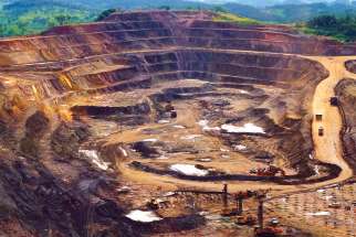 Excavators and drillers work in an open pit at a copper and cobalt mine in Likasi, Congo. There’s a push on to have stock market regulators demand the truth from mining companies overseas.
