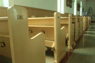 Empty pews are pictured in a file photo at St. Irenee&#039;s Catholic church in the Charlevoix region, near Quebec City. During the COVID-19 pandemic, the Quebec government is limiting churches to 50 people inside, 25 in riskier regions.