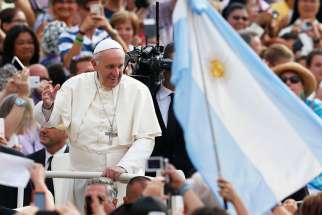 Argentina&#039;s flag is seen as Pope Francis greets the crowd during his general audience in St. Peter&#039;s Square at the Vatican Aug. 31, 2016.