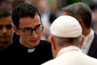  Pope Francis greets a participant during a meeting with seminarians from Italy&#039;s Lombardy region at the Vatican Oct. 13. 