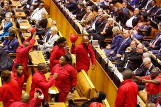 Economic Freedom Fighters disrupt South African President Jacob Zuma during his State of the Nation address in Cape Town Feb. 11. 