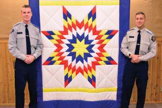 The Kairos Blanket Exercise will now be part of the training for every RCMP cadet, like Matt Plaskett, left, and Habeeb Shah, who recently underwent the exercise at the RCMP Academy in Regina.