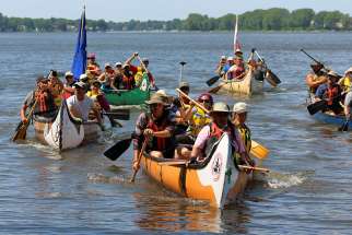 Jesuit and Indigenous pilgrims arrive by canoe Aug. 15 in Kahnawake, a First Nations reserve south of Montreal. It was the group’s final destination after traveling 850 km, following a route used by 17th-century missionaries, in an effort to promote reconciliation.