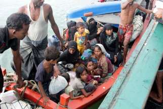 Refugees from Myanmar and Bangladesh are seen in their boat before their rescue by fisherman in Julok, Indonesia, May 20. 