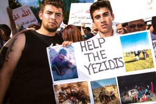 Facing a genocide at home in Iraq, these Yazidi men were eager to protest with Iraqi Christians in Toronto.