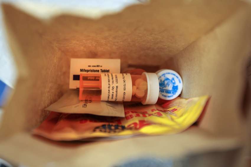 A paper bag containing the mifepristone and misoprostol pills used for a chemical abortion.