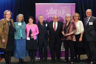 Cindy Stirling, third from right, was recipient of the Stand Up for Kids Award for her 27 years as a foster parent, the last six with Catholic Children’s Aid Society of Toronto.