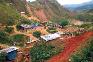 Miners are seen at an artisanal gold mine near Kamituga, Congo. D&amp;P has been fighting against mining injustice.x
