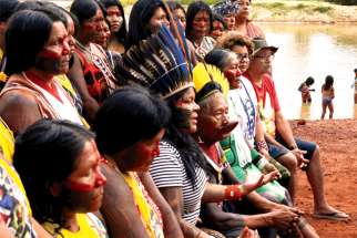 Indigenous people are seen on the banks of the Xingu River in Brazil’s Xingu Indigenous Park. Canada and the Amazon region both face issues over their Indigenous populations.