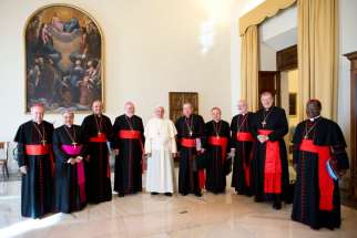 Pope Francis poses with cardinal advisers during a meeting at the Vatican in this picture dated Oct. 1. The Council of Cardinals began the first draft of a new apostolic constitution at its sixth meeting Sept 15-17 with Pope Francis.