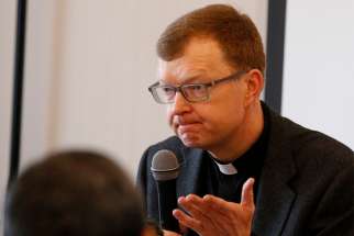 Jesuit Father Hans Zollner, a member of the Pontifical Commission for the Protection of Minors, is pictured in a 2019 file photo. The increased screen time and isolation because of quarantine measures or restrictions during the COVID-19 pandemic have put vulnerable minors at greater risk of grooming and abuse online, Father Zollner said.