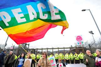 Protesters stage a sit-in at Faslane Naval Base in Helensburgh, Scotland, April 13, 2015.