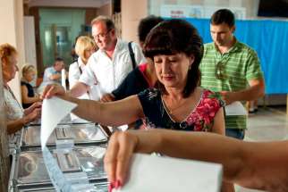 Ukrainians vote in the parliamentary elections in Sevastopol, Ukraine, Sept. 14. Millions of Ukrainians will go to the polls Oct. 26 to elect new members of parliament; all 450 seats were up for renewal.