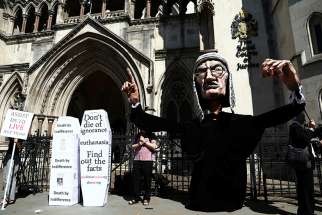 Anti-euthanasia protesters demonstrate outside the Royal Courts of Justice in London July 17, 2017. The head of the U.K. Catholic Medical Association says a professional physicians&#039; body is conducting a sham poll on euthanasia. 