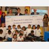 Students from Blessed John Paul XXIII gather around a cheque from the Indigo Love of Reading Foundation. From left to right, principal Anna Chiesa, Jennifer Jones, Indigo Love of Reading Foundation director, Robin Huismans, Indigo Love of Reading Foundation co-ordinator, Bruce Rodrigues, TCDSB director of education, superintendent Michael McMorrow and vice-principal Jacqueline Puri.