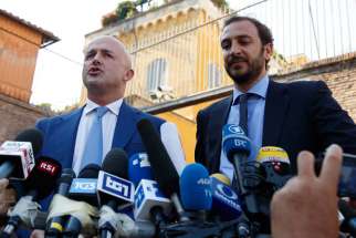 Italian journalists Gianluigi Nuzzi and Emiliano Fittipaldi speak to the media after leaving the final session of the so-called &quot;Vatileaks&quot; trial at the Vatican July 7. A Vatican court, citing freedom of the press, acquitted the two journalists who published confidential Vatican documents. Their source, Spanish Msgr. Lucio Vallejo Balda, was sentenced to 18 months behind bars.