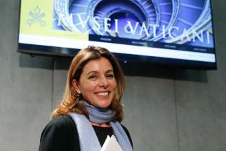 Barbara Jatta, the new director of the Vatican Museums, leaves a Jan. 23 Vatican news conference at which the revamped, mobile-compatible website for the Vatican Museums was unveiled.
