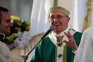 Pope Francis smiles as he celebrates Mass at the Royal Palace of Caserta in Italy July 26. In an interview published in part in the Argentine weekly &quot;Viva&quot; July 27, Pope Francis listed his Top 10 tips for bringing greater joy to one&#039;s life.