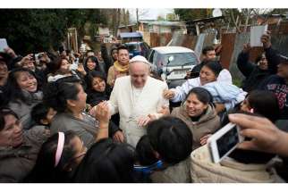 Latin American immigrants in Rome greet Pope Francis Feb. 8. 