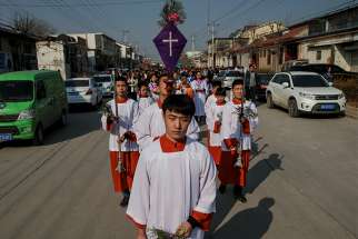  Altar servers lead a Palm Sunday procession March 25 in Youtong, in China&#039;s Hebei province.
