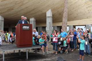 Answers in Genesis President and Co-Founder Ken Ham speaks during a press conference, ringed by supporters, before a ribbon cutting event at the foot of the full-scale Noah&#039;s Ark replica at the Ark Encounter on July 5, 2016, in Williamstown, Ky.