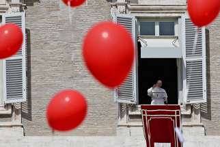Pope Francis leads the Angelus from the window of his studio overlooking St. Peter&#039;s Square March 11 at the Vatican.