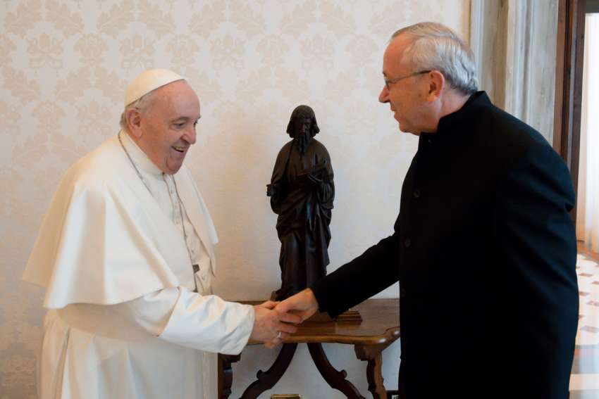 Pope Francis greets Jesuit Father Marko Rupnik during a private audience at the Vatican in this Jan. 3, 2022, file photo.