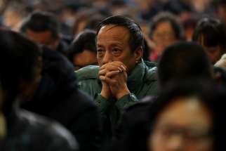  A man prays during a 2017 Mass at the Cathedral of the Immaculate Conception in Beijing. 