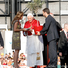 Pope Benedict XVI receives gifts from young people during a World Youth Day welcoming ceremony in central Madrid Aug. 18. 