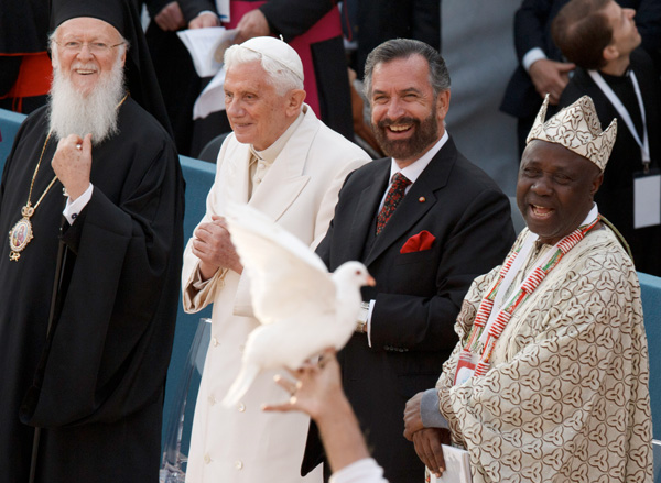 Ecumenical Patriarch Bartholomew of Constantinople, Pope Benedict XVI, Rabbi David Rosen and Wande Abimbola, representative for the Yoruba religion of Nigeria, smile as a dove is held up during the interfaith meeting for peace outside the Basilica of St. Francis in Assisi, Italy, Oct. 27.