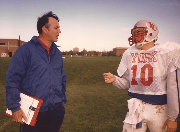 Coach Frank Cosentino offers some instruction to one of his York Yeomen players in this photo from the mid-1980s. York University is honouring Cosentino, now 74, with a dinner May 11.