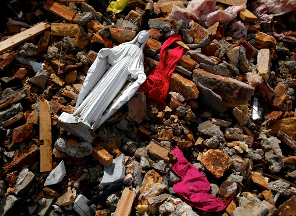 A statue of Mary lies March 4 in the rubble of St. Luke Catholic Church destroyed by a tornado in Salyersville, Ky. Calm weather gave residents of storm-wracked towns a respite as they dug out from a chain of tornadoes that cut a swath of destruction March 2 from the Midwest to the Gulf of Mexico, killing at least 39 people in five states.