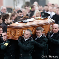 Members of the Police Service of Northern Ireland carry the casket of officer Ronan Padraig Kerr to the Church of the Immaculate Conception in the village of Beragh April 6. (CNS photo/Cathal McNaughton, Reuters)