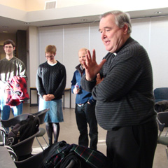 Students look on as Bishop Richard Gagnon speaks at the “Dish with the Bish” event on March 16, part of Catholic Students Week. 
