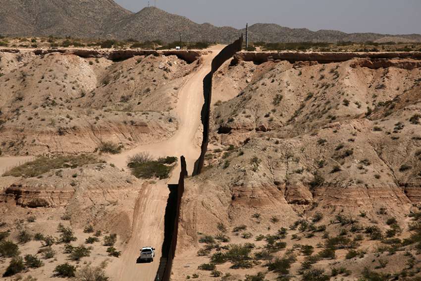 A Border Patrol vehicle is seen close to the current border fence in Sunland Park, N.M., in this photo taken April 4 from Ciudad Juarez, Mexico.