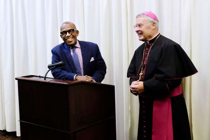 Bishop R. Walker Nickless of Sioux City, Iowa, introduces guest speaker Al Roker prior to the start of the bishops&#039; dinner in Sioux City Sept. 24.