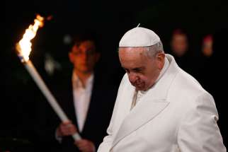 Pope Francis presides at the Way of the Cross outside the Colosseum in Rome April 3.