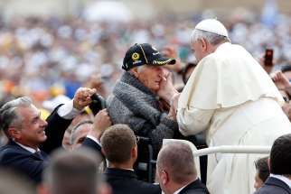 An elderly woman becomes emotional as Pope Francis greets her as he arrives for a May 2014 weekly audience in St. Peter&#039;s Square at the Vatican. The most serious ailment the elderly face and the greatest injustice they suffer is abandonment, Pope Francis said.